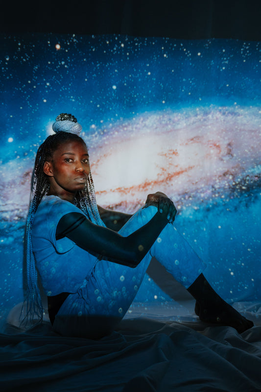 Galaxy star projector lighting up a room with a celestial night-sky effect