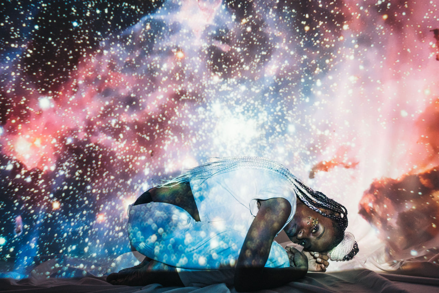 Galaxy projector light setting a dreamy mood in a dark room